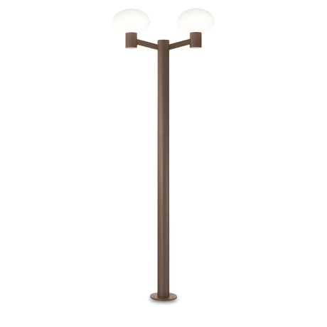 The Photonix Twin Head Lamp Post - Brown boasts a modern design with a sleek, brown pole and two symmetrical, white glowing lights at its peak. This contemporary outdoor lamp post is showcased against a plain white backdrop, providing ambient lighting that enriches any environment.