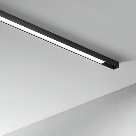 A stylish Linear LED Surface-Mounted Track Light 6W 3000K is elegantly mounted on a white ceiling, offering a bright and even glow. Ideal for modern interiors, its dimmable feature enhances the minimalist design while perfectly complementing the clean, neutral background.