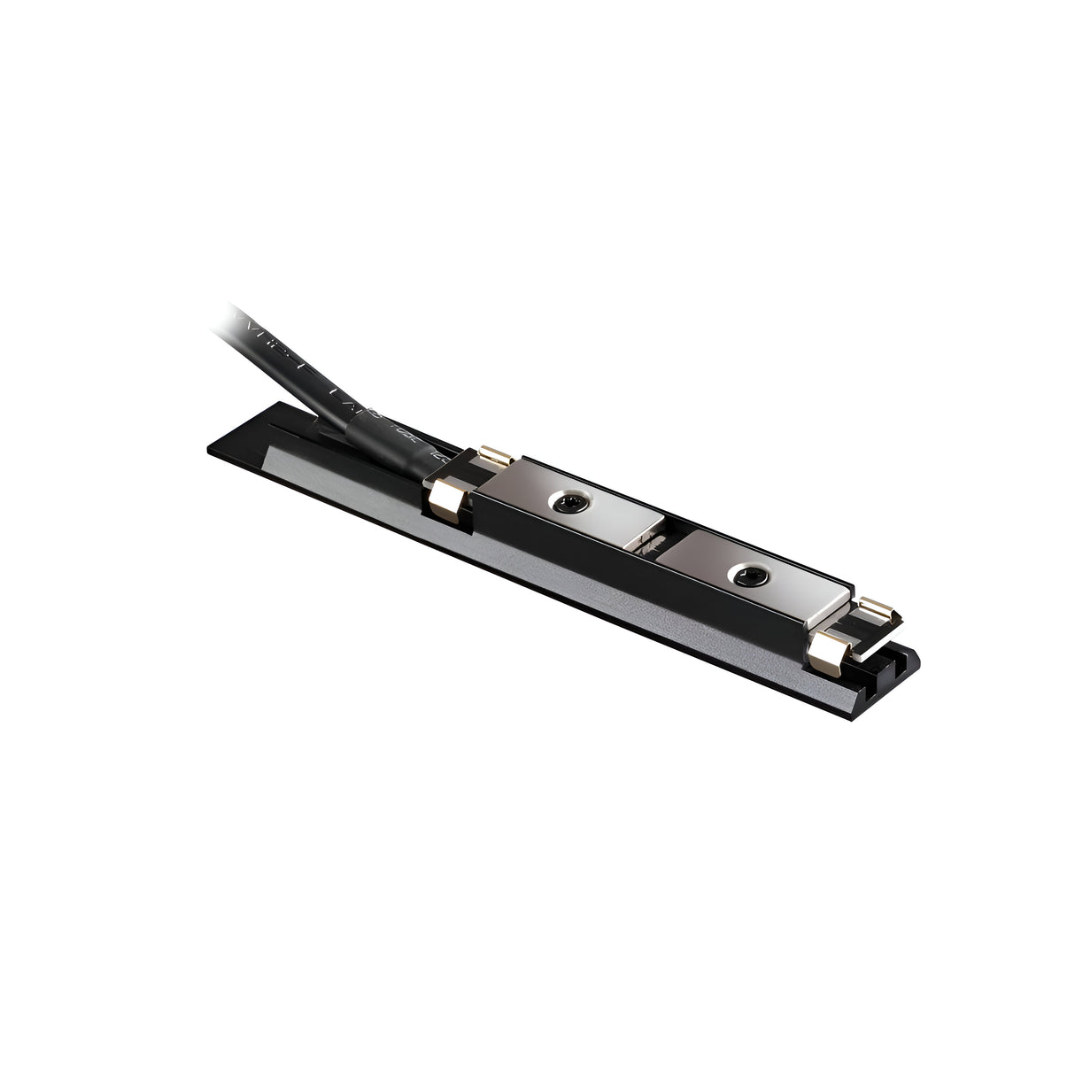 Close-up of the Viora Magnetic Track Lighting Power Input Connector in black, showcasing its sleek, rectangular design with a cable attached, highlighting the metal components on a flat base. The cable emerges from one end, indicating electronic connectivity and customizable cable length for precise installations.