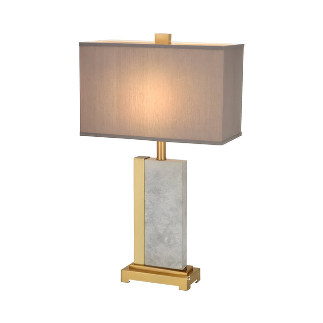 The Orvani 1 Light Structured Form Marble Table Lamp in brass and grey features a geometric design with a rectangular beige shade, gold and marble base, and emits a warm glow when turned on.