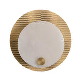 The Avelora LED Round Alabaster Wall Light features a perforated gold backplate, a solid white front plate, and a small gold accent disc, blending soft white and brass elements in an elegant design set against a plain white background.