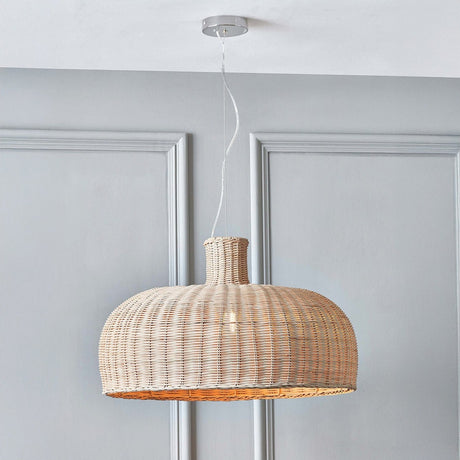 Caswell Rattan Dome pendant light with natural woven shade and short chrome ceiling suspension, hanging against panelled grey walls.