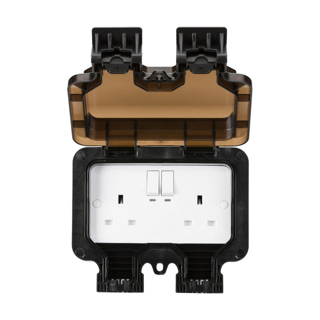 The Smart IP66 13A 2 Gang Outdoor Socket features a protective black and brown cover, which is open to display a smart double plug outlet with two switches. This weatherproof unit is specifically designed for outdoor use and includes power monitoring for enhanced convenience.