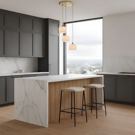 A modern kitchen with dark gray cabinets, white marble countertops and backsplash, a central island with wood paneling, two beige barstools, and a Vantor 3 Light Alabaster Cluster Pendant Light above. Large window with city view.