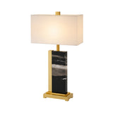 The Vellum 1 Light Structured Form Marble Table Lamp features a brass frame, black marble base with white and gray streaks, and a rectangular white shade, shown against a white background.