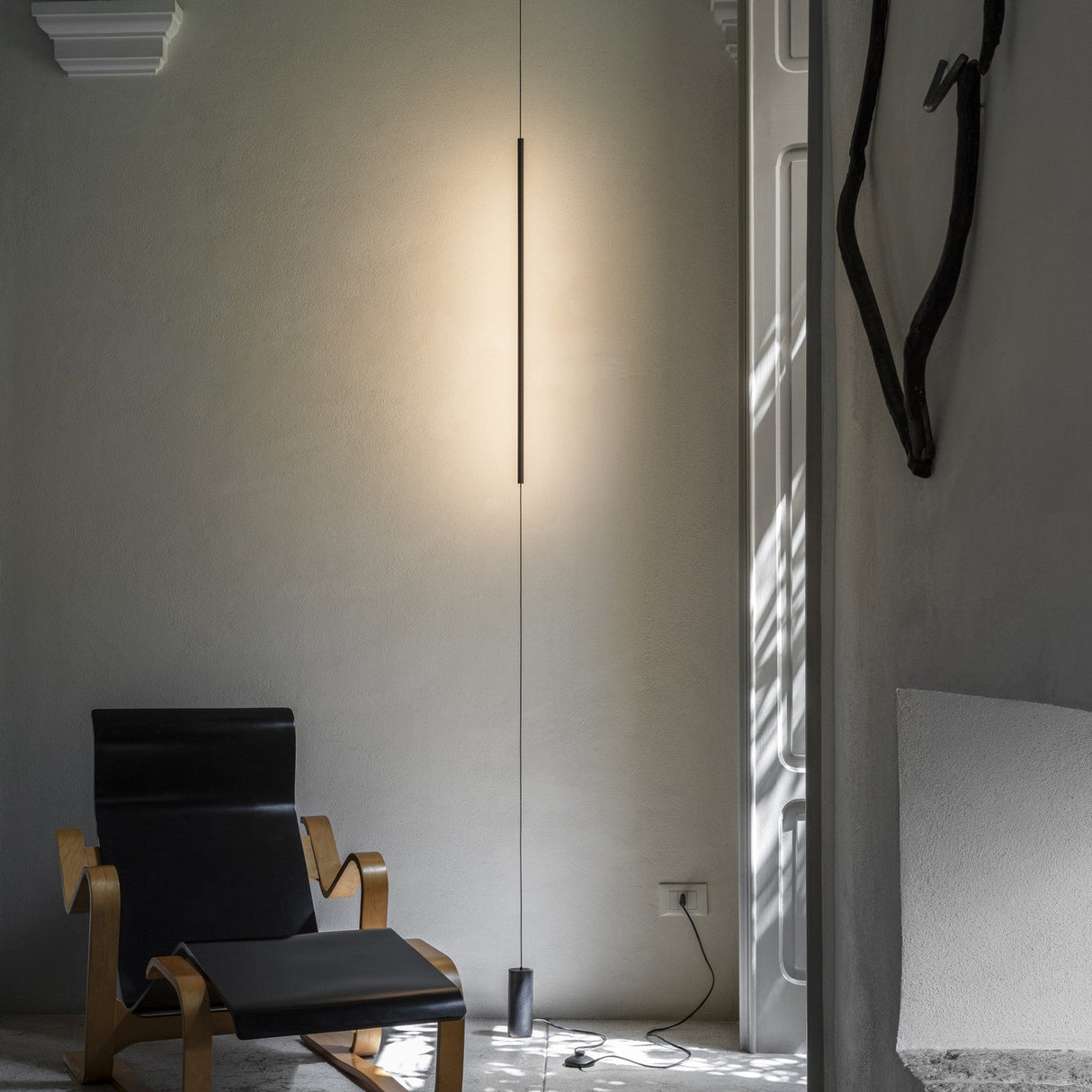 Essence Round Floor to Ceiling Lamp - Black in situ