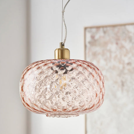 Azores Rose Textured Glass Oval Pendant Light, 25cm, with brass fitting, hanging indoors near a light wall and framed artwork.