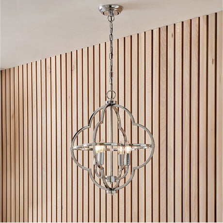 Amine Chrome 4 Light Fleur De Lys Pendant, 47cm, hanging from a chain with an open circular frame and four candle-style bulbs, shown against wood slat panelling.
