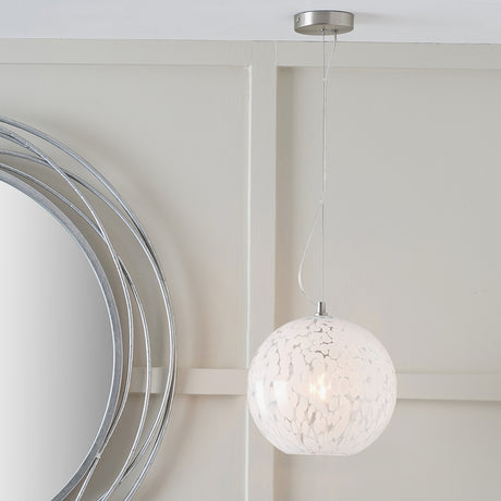 Aurora Speckled White Glass Pendant Light, 25cm globe shade on a brushed metal ceiling fitting, hung in a room beside a round mirror with a chrome frame.