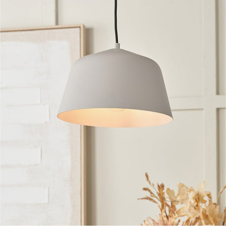 Amalie Grey Metal Retro Pendant Light, 30cm, tapered steel shade with white interior, shown lit and hanging in a neutral-toned living space.