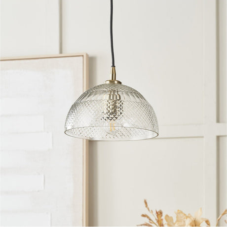 Giselle Diamond Design Clear Handcut Glass Dome Pendant Light, 23cm, with textured clear glass shade and brass fitting, shown hanging in a light-toned living space.