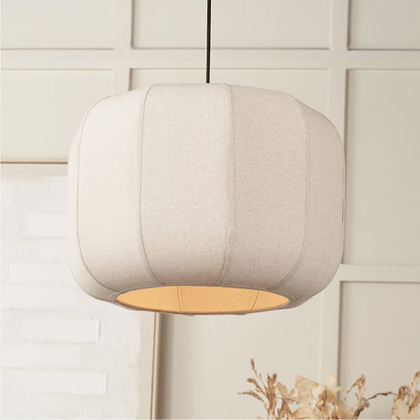 Oscar Linen Structured Pendant Light, 51cm, with a rounded barrel-shaped natural linen shade and dark cord, hung in a neutral living space.