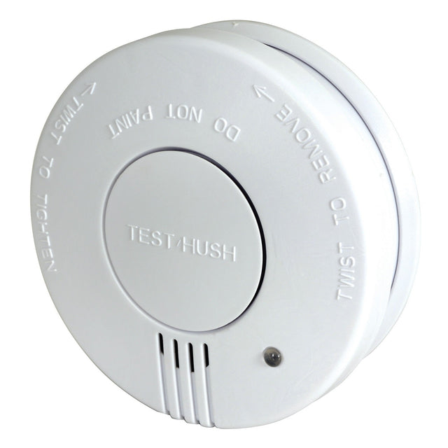 The Mercury Smoke Detector With Hush Button is a white, early warning photoelectric alarm that features clear surface instructions such as TEST/HUSH, DO NOT PAINT, and TWIST TO REMOVE. It includes a small circular button for testing and a grill for the alarm sound, with a hush feature that allows temporary silencing of alerts to enhance safety.