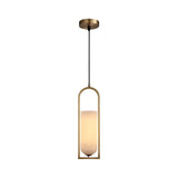 The Arvion 1 Light Slim Capsule Alabaster Single Pendant Light features a cylindrical alabaster shade in soft white, suspended within a brushed brass frame and hanging from a black cord with a round brass ceiling mount.