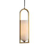 The Arvion 1 Light Slim Capsule Alabaster Single Pendant Light features a soft white alabaster shade in a vertical, oval brushed brass frame, suspended by a black cord for a modern look.