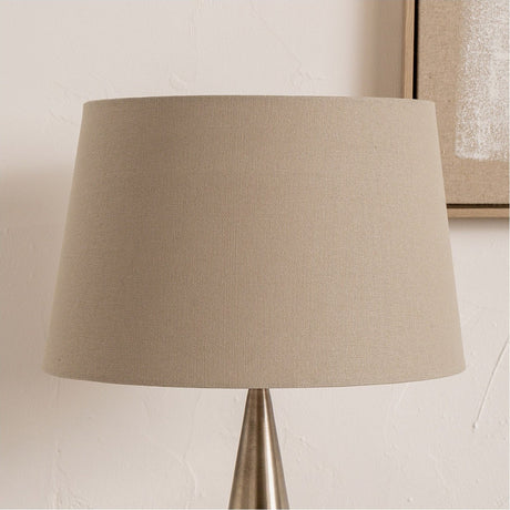 Winston Taupe Handloom Tapered Lampshade, 45cm, in fabric with a beige finish, shown on a table lamp with a brushed metal base against a light wall.
