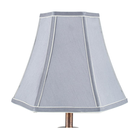 Lyla Steel Grey Silk Mix Bowed Lampshade, 25cm, hexagonal shape with white piping trim, shown on a bronze lamp base against a plain white background.