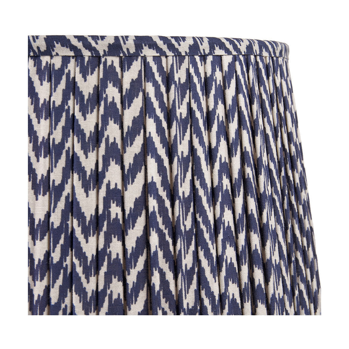 Close-up of the Vienna Blue Chevron Pleated Lampshade, 40cm, in fabric with a navy and cream zigzag pattern, shown against a plain white background.