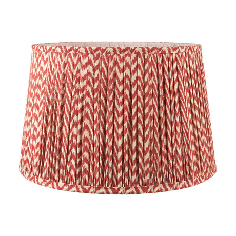 Vienna Red Chevron Pleated Lampshade, 50cm wide, in pleated red and cream zigzag fabric with a tapered drum shape, shown on a plain white background.
