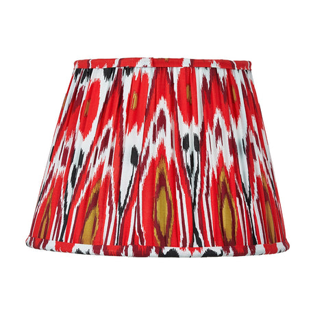 Izara Red Ikat Pleated Tapered Lampshade, 30cm, in a bold red, white and black patterned fabric with pleated sides, shown on a plain white background.