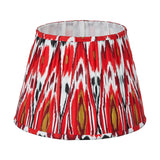 Izara Red Ikat Pleated Tapered Lampshade, 30cm, in a red, white, and black ikat pattern fabric with pleated sides, shown on a plain white background.