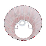 Izara Red Ikat Pleated Tapered Lampshade, 30cm, shown from below with pleated pale pink fabric and a red-and-black patterned trim, on a white steel frame against a plain background.