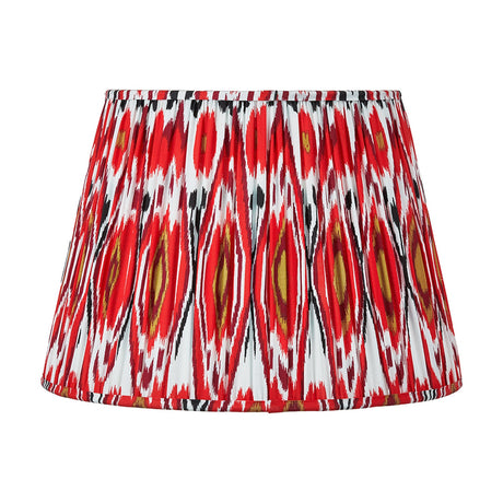 Izara Red Ikat Pleated Tapered Lampshade, 45cm, in a bold red, black and white diamond ikat pattern with fabric pleats, shown against a plain white background.