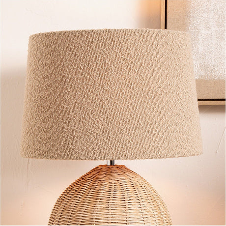 Martigues Taupe Boucle Tapered Lampshade, 35cm, shown fitted on a woven rattan base lamp against a light neutral wall.