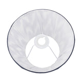 Kamilah Blue Chevron Pleated Tapered Lamp Shade, 25cm, in white fabric with a dark trim edge, shown from above with a white spider fitting, on a plain white background.