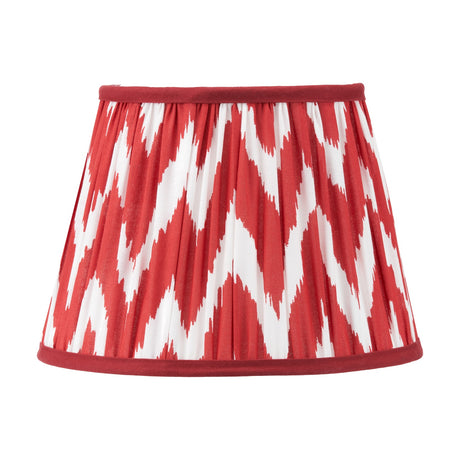 Kamilah Red Chevron Pleated Tapered Lamp Shade, 25cm, in red and white zigzag fabric with a red trim, shown on a plain white background.
