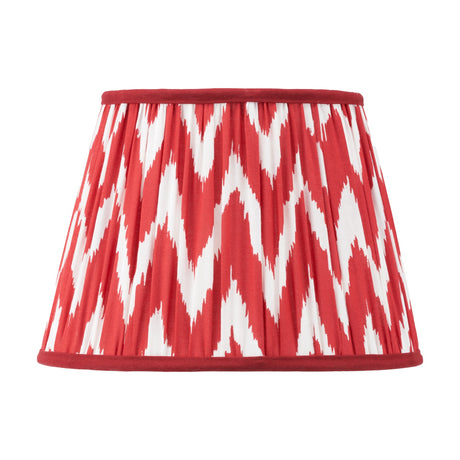 Kamilah Red Chevron Pleated Tapered Lamp Shade, 30cm, in red and white zigzag fabric with red trim, shown on a plain white background.