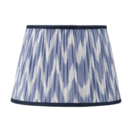 Kamilah Blue Chevron Pleated Tapered Lamp Shade, 35cm, in pleated fabric with a blue and white zigzag pattern and navy trim, shown on a plain white background.