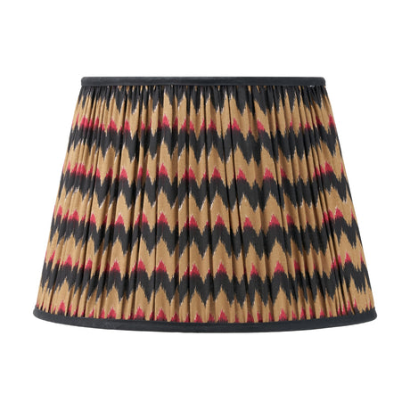 Athira Multi Chevron Design Pleated Tapered Lamp Shade, 40cm, in fabric with a black, tan, and red zigzag pattern and black trim, shown on a plain white background.