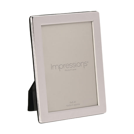 Flat edge rectangular photo frame in silverplated metal with a smooth broad border, holding a 6 x 4in print and shown upright with an easel back on a plain white background.
