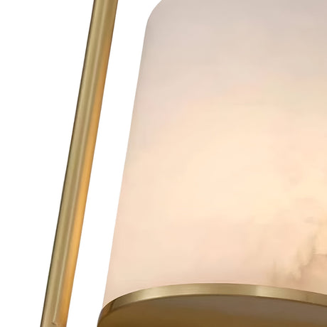 Close-up of the Halorin 1 Light Framed Alabaster Single Pendant Light in soft white with a brushed brass frame, featuring smooth lines, a minimalistic design, and an elegant alabaster shade.