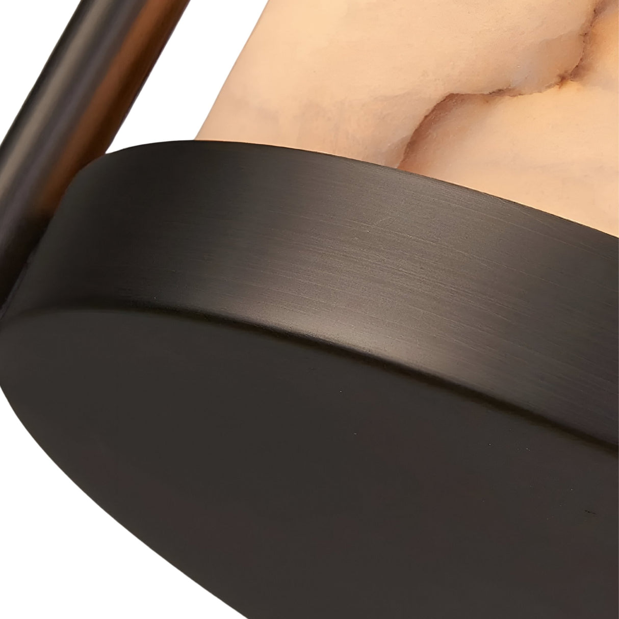 Close-up of the Halorin 1 Light Framed Alabaster Single Pendant Light in soft white and matte black, highlighting its smooth alabaster-inspired glass shade and rounded edges, with a sleek matte black base.