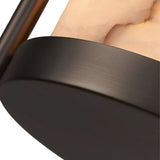 Close-up of the Halorin 1 Light Framed Alabaster Single Pendant Light in soft white and matte black, highlighting its smooth alabaster-inspired glass shade and rounded edges, with a sleek matte black base.