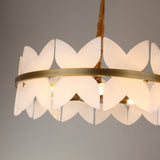 Niori Petraia 6 light chandelier with two staggered rings of white alabaster petals around a brushed brass band, suspended from a fabric-wrapped cable.