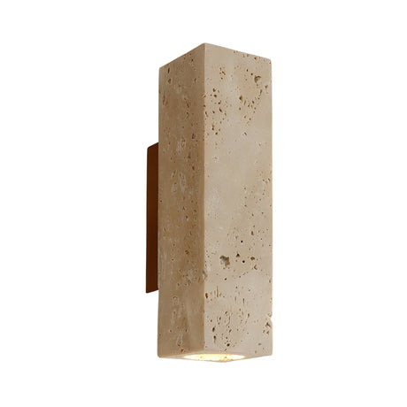 The Bravora 1 Light Large Rectangle Travertine Wall Light features a light beige textured stone-like surface that glows from the bottom, mounted on a walnut brown backplate against a white background.