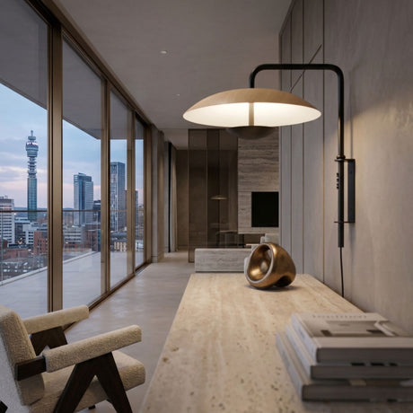A modern, minimalist office with floor-to-ceiling windows, city skyline view, a textured desk with books and sculpture, a cozy chair, and the Ginger LED Wall Light - Black & Oak adding elegant, minimalist lighting.