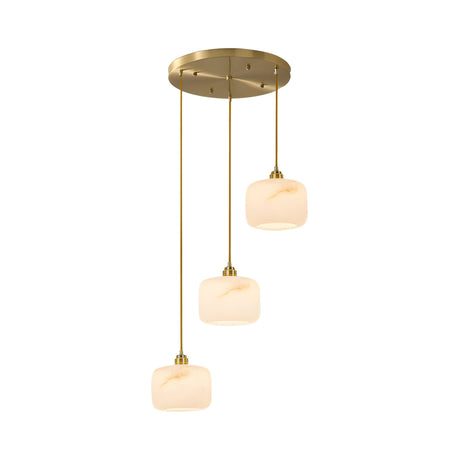 The Vantor 3 Light Alabaster Cluster Pendant Light features three soft white alabaster shades hanging at staggered heights from a round brushed brass mount for a sleek, modern look.