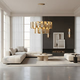 A modern living room with white sofas, round coffee tables, a black accent wall with a minimalist fireplace, abstract art, floor-to-ceiling windows, sheer curtains, and a gold chandelier. The Aurelian LED Double Column Alabaster Wall Light adds subtle elegance.