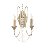 Belle 2-light wall light in antique silver leaf metal, 48cm, with curved scrolling arms, crystal bead strands and drops, candle-style E14 bulbs, on a plain white background.