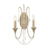 Belle 2-light wall light in antique silver leaf metal, with curved arms, candle-style E14 bulbs, and cascading crystal beads, shown on a plain white background.
