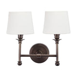 Piero Antique Bronze Double Wall Light with two arms, ball feet, and white handloom fabric shades, shown on a plain white background.