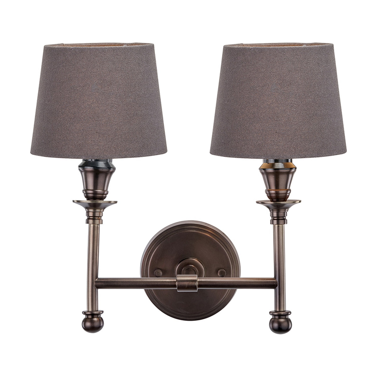 Piero Antique Bronze Double Wall Light with two tapered grey fabric shades on a curved metal arm and round backplate, shown on a plain white background.
