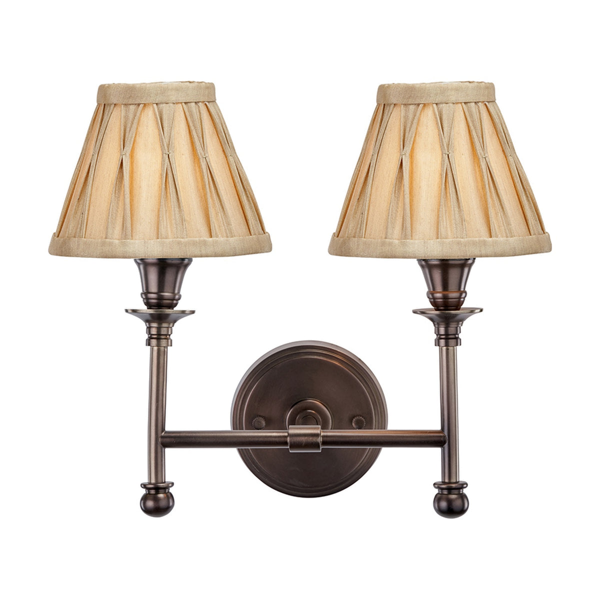 Piero Antique Bronze Double Wall Light with two pleated fabric shades on curved arms, joined by a round backplate, on a plain white background.