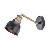 Augusto Black & Gold Task Wall Light with a matt black domed shade on an adjustable brass arm and round wall plate, shown on a plain white background.