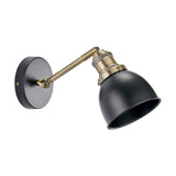 Augusto Black & Gold Task Wall Light with adjustable brass arm and matte black dome shade on a round wall mount, shown on a plain white background.