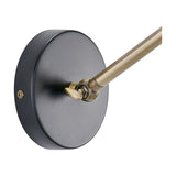 Augusto Black & Gold Task Wall Light - 16cm, close-up of the round matt black wall plate with an antique brass adjustable arm joint, shown on a plain white background.